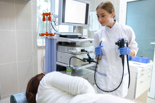 Picture of female Medical Professional assisting a female patient.